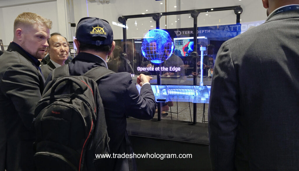 Large Hologram Display attracts attention at a trade show booth.